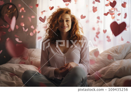 AI-generated content. A happy woman in a bedroom experiences joy as heart-shaped confetti falls on her AI-generated content. A happy woman in a bedroom experiences joy as heart-shaped confetti falls on her 109435256