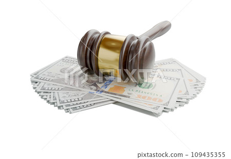 Gavel Resting on Stacks of Thousands of Dollars Isolated on a White Background. Gavel Resting on Stacks of Thousands of Dollars Isolated on a White Background. 109435355