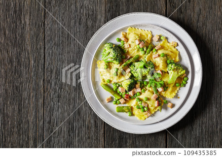 ravioli primavera with ham on a grey plate ravioli primavera with ham on a grey plate 109435385
