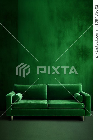 Elegant luxury green velvet sofa in a waiting room against a textured green wall 109435602