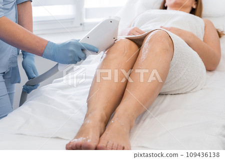 A step towards perfect skin, where the photo shows the process of laser hair removal in beauty salon, which woman organized for herself during a vacation. Professional care at specialist cosmetologist 109436138