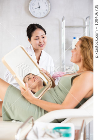 young doctor consulting with mirror young doctor consulting with mirror 109436739