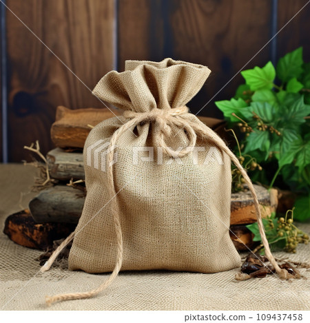 Linen decorative bag. Blurred rustic background Generative AI 109437458