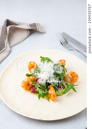 beautifully served shrimp with arugula and grated cheese, side view beautifully served shrimp with arugula and grated cheese, side view 109439767