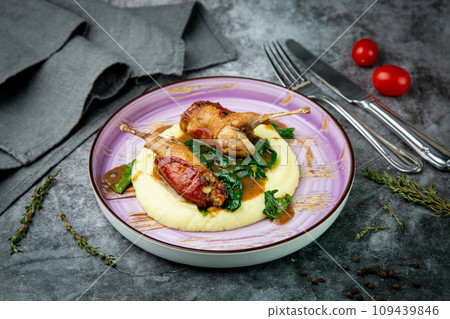 baked chicken wings with gravy, spinach and mashed potatoes top view 109439846