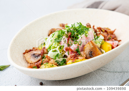 salad with potatoes, rice, meat and green onions side view salad with potatoes, rice, meat and green onions side view 109439898