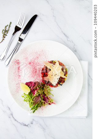 meat salad with arugula and lime, top view meat salad with arugula and lime, top view 109440203