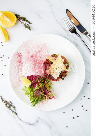 meat salad with arugula and lime, top view meat salad with arugula and lime, top view 109440216