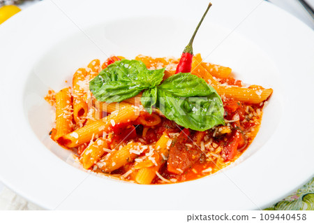 pasta in tomato sauce with cheese and herbs side view pasta in tomato sauce with cheese and herbs side view 109440458