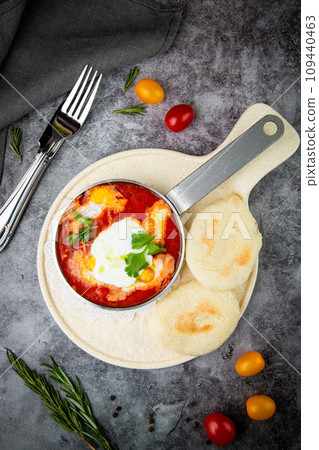borscht in a frying pan with fresh flatbreads and cherry tomatoes top view borscht in a frying pan with fresh flatbreads and cherry tomatoes top view 109440463