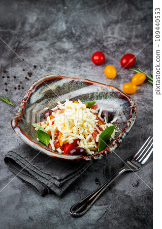 cherry tomatoes, spinach, eel, lime, cheese, side view 109440553