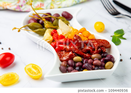 assorted nuts and dried vegetables on a light background side view 109440936