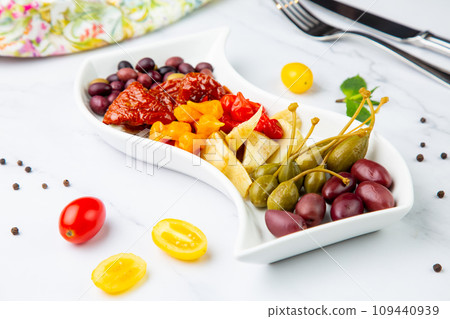 assorted nuts and dried vegetables on a light background side view 109440939