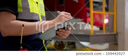 Closeup hands of engineer man or worker checking electric train for planning maintenance. Closeup hands of engineer man or worker checking electric train for planning maintenance. 109442027