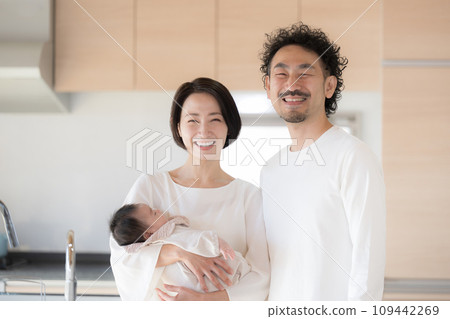 A happy portrait looking at the camera in front of the kitchen A happy portrait looking at the camera in front of the kitchen 109442269