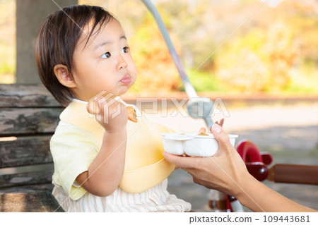 Infants and toddlers eating on the go, autumn, copy space 109443681