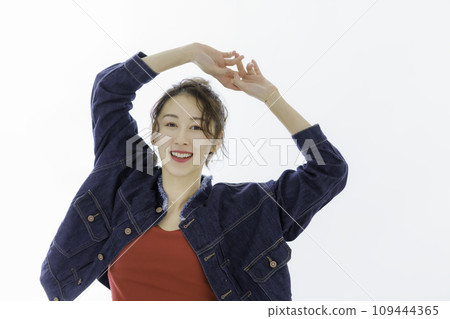 Portrait of a young woman stretching 109444365