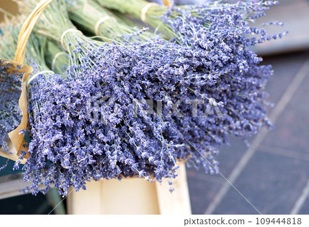 France Nice market. Dry lavender for sale. Light purple colour. Pattern of small natural violet elements. Aromatic mediterranean product. Colorful image. France Nice market. Dry lavender for sale. Light purple colour. Pattern of small natural violet elements. Aromatic mediterranean product. Colorful image. 109444818