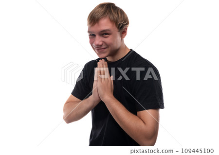 European teenage guy with brown hair smiles while talking European teenage guy with brown hair smiles while talking 109445100