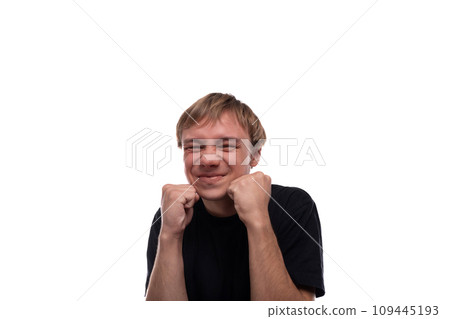 Satisfied European teenage guy with brown hair on a white background Satisfied European teenage guy with brown hair on a white background 109445193