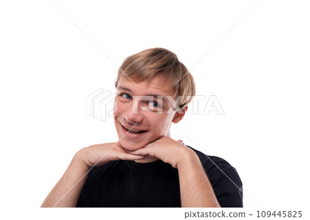 Headshot portrait of a blond Caucasian guy with blond hair dressed in a black T-shirt Headshot portrait of a blond Caucasian guy with blond hair dressed in a black T-shirt 109445825