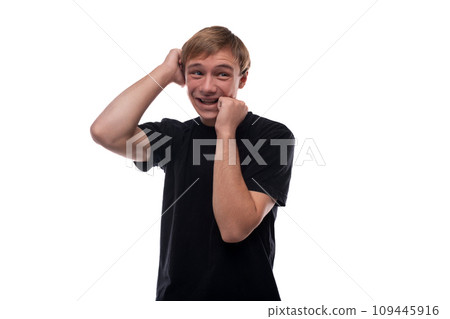 Portrait of a European handsome blond teenager guy in a black T-shirt 109445916