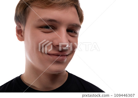 Cute fair-haired teenager guy on a white background, close-up portrait 109446307