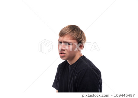 Portrait of an emotional teenage guy with brown hair Portrait of an emotional teenage guy with brown hair 109446497