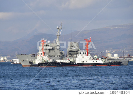 Photographing the scenery of a Self-Defense Force ship being towed to Hakodate dock at Hakodate Port in Hakodate City, Hokkaido in winter 109448304