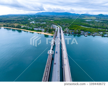 Aerial top view drone shot of bridge with cars on bridge road image transportation background concept,Aerial view of sarasin bridge in Phuket Thailand transportation background,Top view 109448672