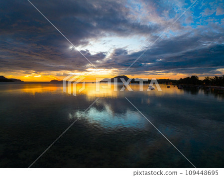 Amazing sunset or sunrise sky over sea landscape,Beautiful colorful light of nature seascape background,Drone aerial view ocean background 109448695