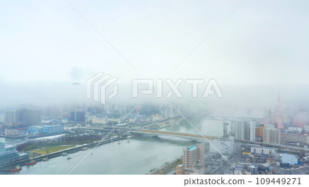 Aerial view of a town shrouded in fog 109449271