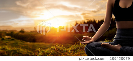 Young woman practicing yoga in sunset time 109450079