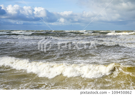 Stormy weather seascape, big waves with foam, low dark cumulus clouds, stormy sea view Stormy weather seascape, big waves with foam, low dark cumulus clouds, stormy sea view 109450862