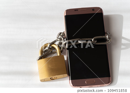 padlock and smartphone padlock and smartphone 109451858