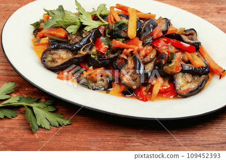 Aubergine saute, vegetable stew, caponata. Aubergine saute, vegetable stew, caponata. 109452393