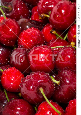Background close up of ripe cherries with water drops 109452398