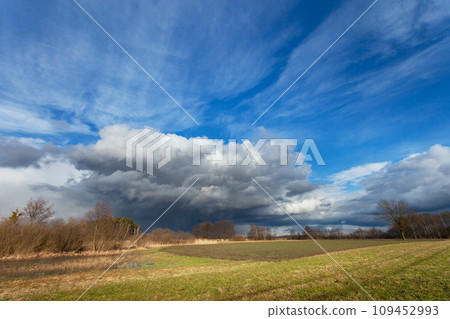 Fantastic clouds over the fields 109452993