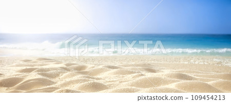 Tropical sea and sandy beach with blue sky background. Empty sandy beach. Closeup of sandy beach with turquoise sea and sky background 109454213