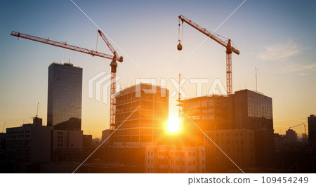 Construction site with tower crane. Construction of residential buildings. Panoramic view of construction of skyscrapers. 109454249