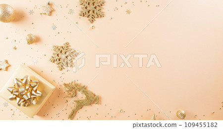 Happy New year celebration background concept. Golden gift box, stars, christmas ball and champagne on pastel background. 109455182