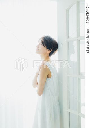 Middle woman bathing in the morning sun 109456474