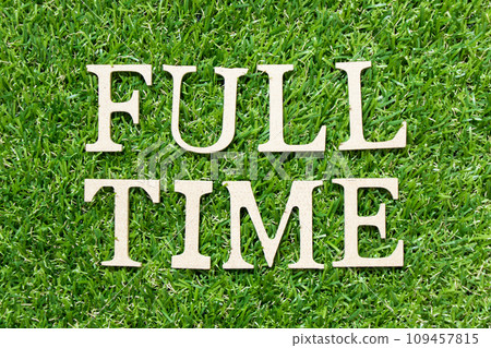 Wood letter in word full time on green grass background Wood letter in word full time on green grass background 109457815