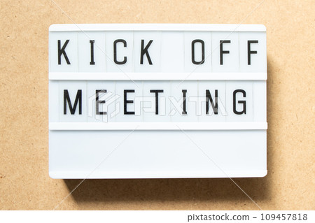 Lightbox with word kick off meeting on wood background 109457818
