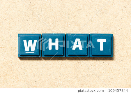 Tile alphabet letter in word what on wood background Tile alphabet letter in word what on wood background 109457844
