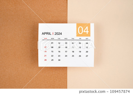 April 2024 calendar page on yellow background. April 2024 calendar page on yellow background. 109457874