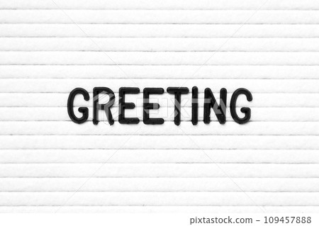 Black color letter in word greeting on white felt board background 109457888