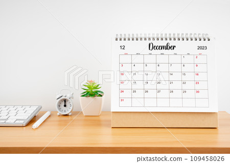 December 2023, Monthly desk calendar for 2023 year on wooden table. 109458026