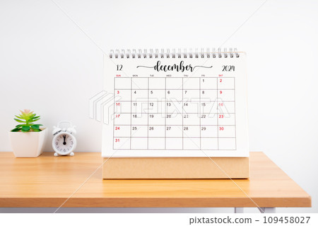 December Monthly desk calendar for 2023 year and alarm clock. December Monthly desk calendar for 2023 year and alarm clock. 109458027