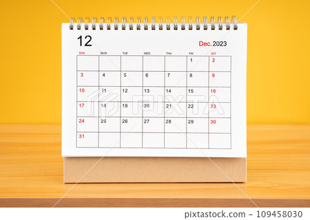 December 2023, Monthly desk calendar for 2023 year on wooden table. 109458030